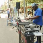 DJ Mickey Breeze spins during the 2019 fest